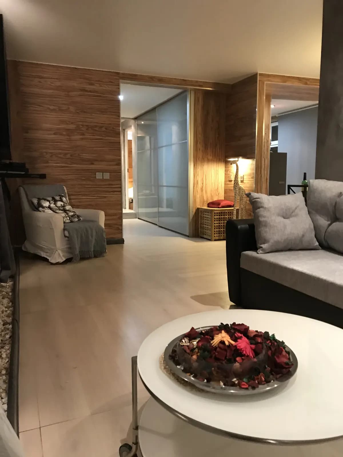 Warm neutral apartment living room designed by ON Home Decor